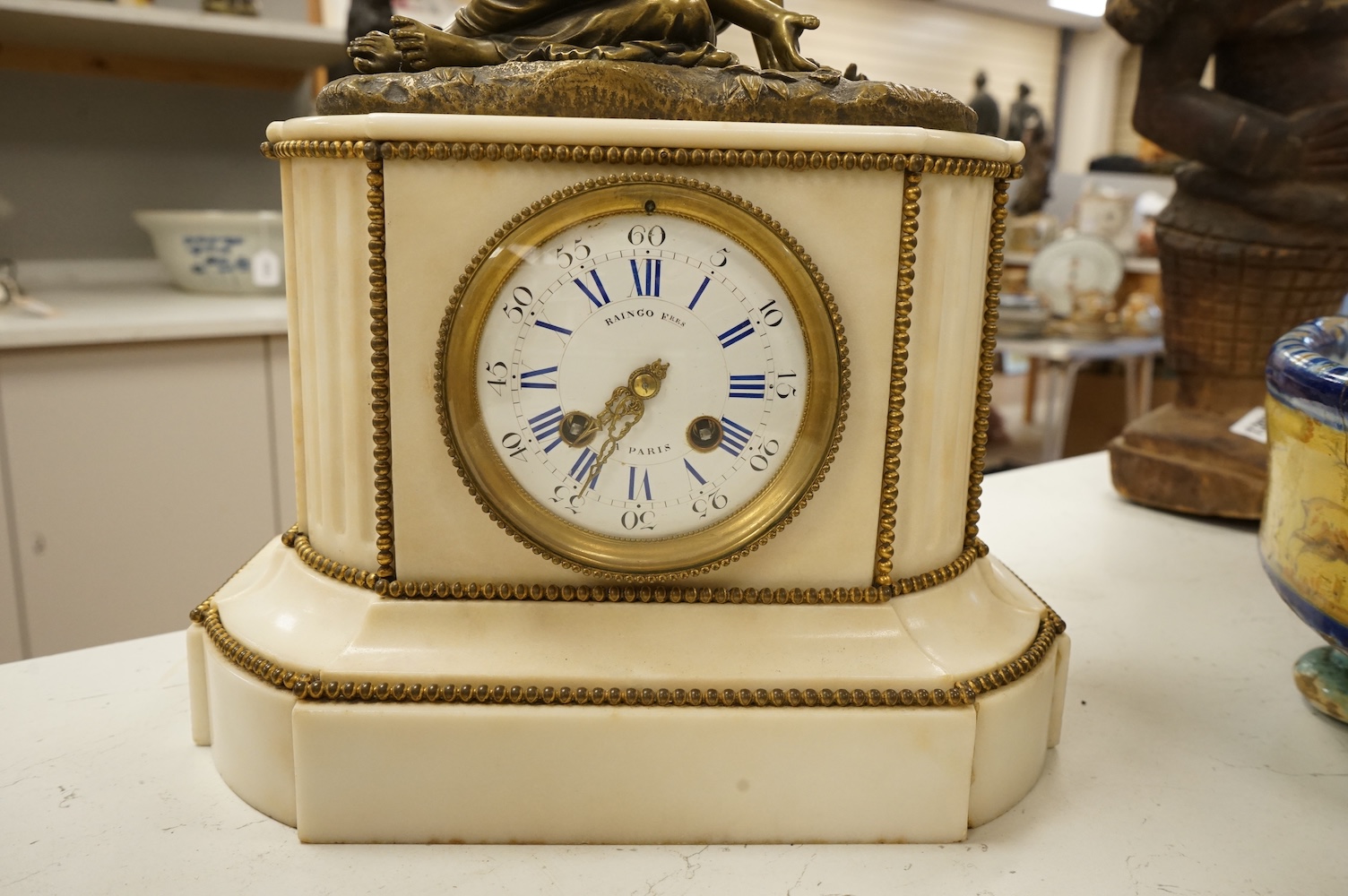 A late 19th century French bronze figural mounted marble mantel clock, 34cm